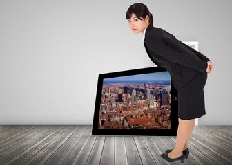 Poster - Composite image of serious businesswoman bending