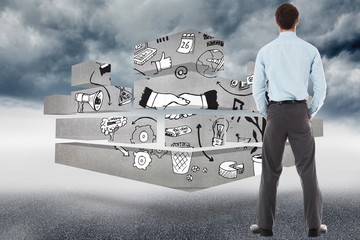 Poster - Composite image of businessman standing with hands in pockets