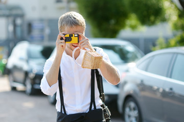 Sticker - Groom shooting his bride with an instant camera