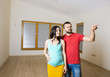 © Halfpoint - Pregnant mother and happy father in new house