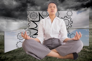Poster - Composite image of businesswoman sitting in lotus pose