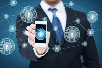 Wall Mural - businessman showing smartphone with network