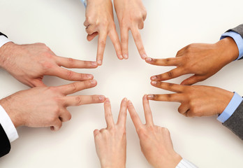 Poster - group of businesspeople showing v-sign