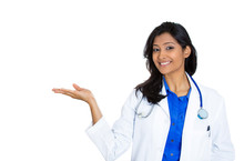 Confiden Female Doctor Pointing At Copy Space