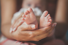 Masseur Massaging Little Baby's Foot, Shallow Focus