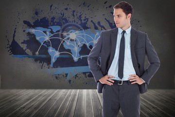 Aufkleber - Composite image of serious businessman with hands on hips