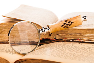 Wall Mural - magnifying glass and old books