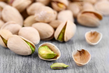 Wall Mural - Pistachio nuts on wooden background