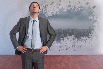 Aufkleber - Composite image of serious businessman with hands on hips