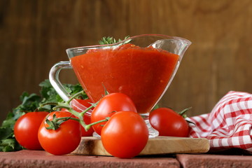 traditional tomato sauce in a glass gravy boat