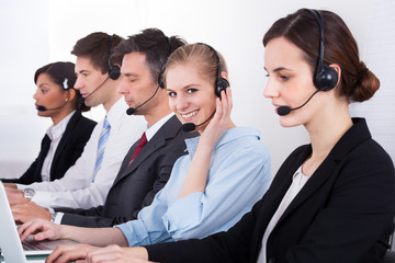 Business People Wearing Headset Working In Office