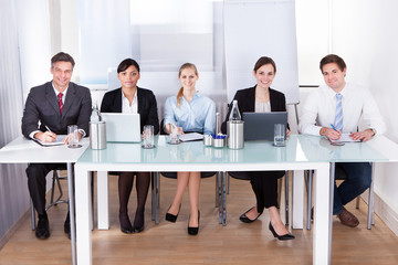 Wall Mural - Businesspeople Sitting In Conference