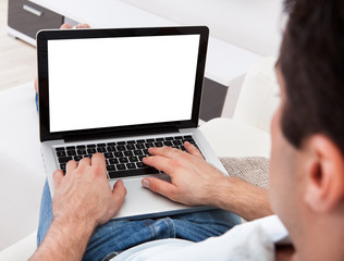 Close-up Of Man Using Laptop