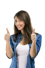 Wall Mural - Beautiful woman with thumbs up, isolated over white background