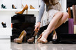 © Karramba Production - Female legs and variety of shoes in the footwear shop