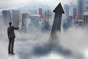 Poster - Composite image of asian businessman pointing