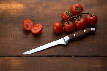 tomatoes on brown textured wood