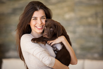 Wall Mural - Beautiful brunette and her dog