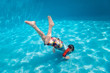 © BlueOrange Studio - Boy swimming underwater