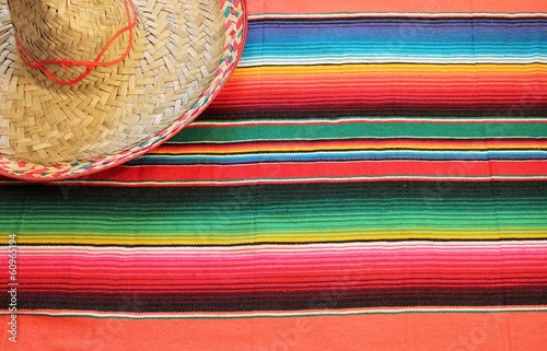 Fotografie, Obraz Mexican poncho sombrero poncho with sombrero cinco de mayo background mexico fie