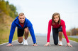 © Jacek Chabraszewski - Urban leisure - woman and man ready to run