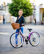 © Jacek Chabraszewski - Urban biking - young woman and bike in city