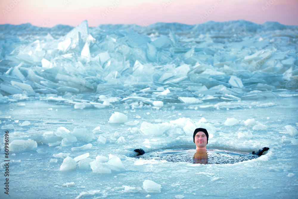 Winter swimming. Man in an ice-hole - obrazy, fototapety, plakaty 