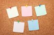 © karandaev - Blank postit notes on cork notice board