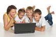 © aletia2011 - Family lying on a floor with laptop