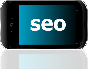 Poster - Web development concept: smartphone with word SEO on display