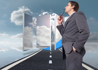 Poster - Composite image of thinking businessman holding his glasses