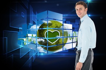 Poster - Composite image of happy businessman standing with hand in pocke
