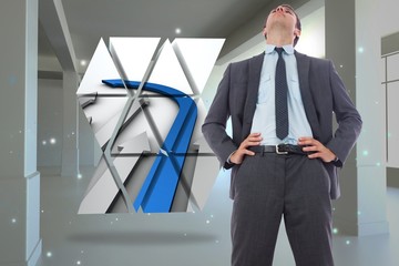 Poster - Composite image of serious businessman with hands on hips