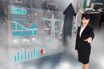 Poster - Composite image of focused businesswoman pointing