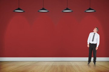 Poster - Composite image of businessman looking up