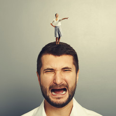 Wall Mural - woman standing on the discontented man