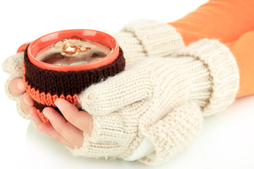 Aufkleber - Cup with knitted thing on it in female hands isolated on white