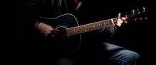 Young Musician Playing Acoustic Guitar And Singing,