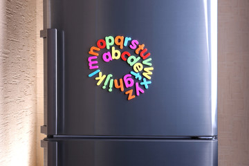 Colorful magnetic letters on  refrigerator