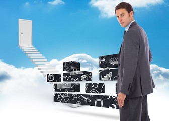 Poster - Composite image of serious businessman with hand on hip