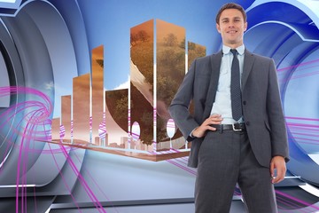 Poster - Composite image of cheerful businessman with hand on hip