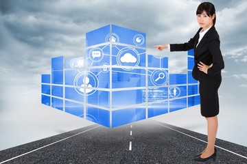 Poster - Composite image of businesswoman pointing