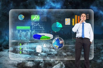 Poster - Composite image of thinking businessman touching chin