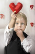 © natalinka29 - Little boy with red Heart in hands. Valentines Day concept