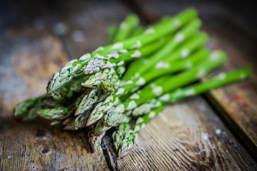 Wall Mural - Asparagus on rustic wooden background