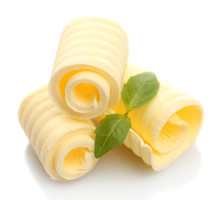 Curls Of Fresh Butter With Basil, Isolated On White