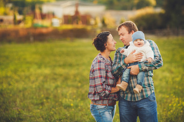 Young happy family having fun at countryside