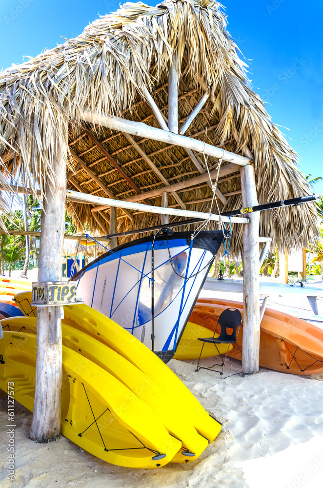 Sailing boats and kayaks on the Caribbean beach in Dominikana - obrazy, fototapety, plakaty 