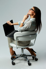 Poster - woman sitting with laptop and looking up 