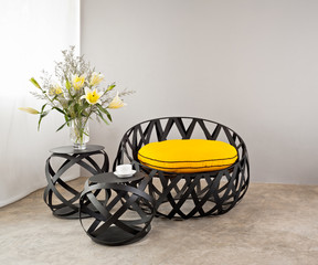 metal sofa with yellow pillow